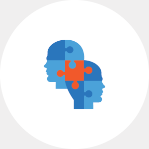 Two heads joined together as puzzle pieces