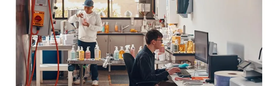 It shows a lab setting for two people using a desktop computer.